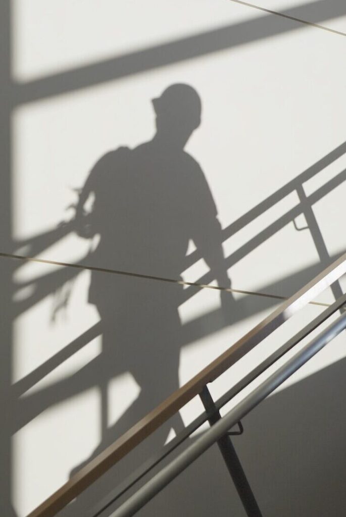 Workers Shadow in a Stairwell